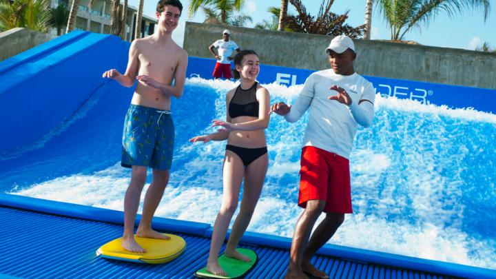 a group of people standing in a pool