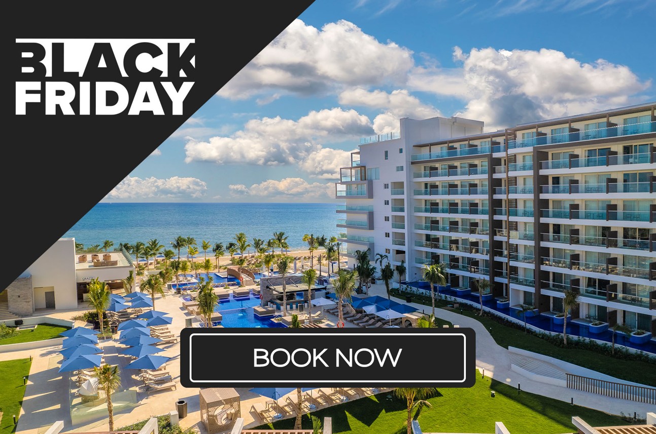 a hotel with a pool and a beach