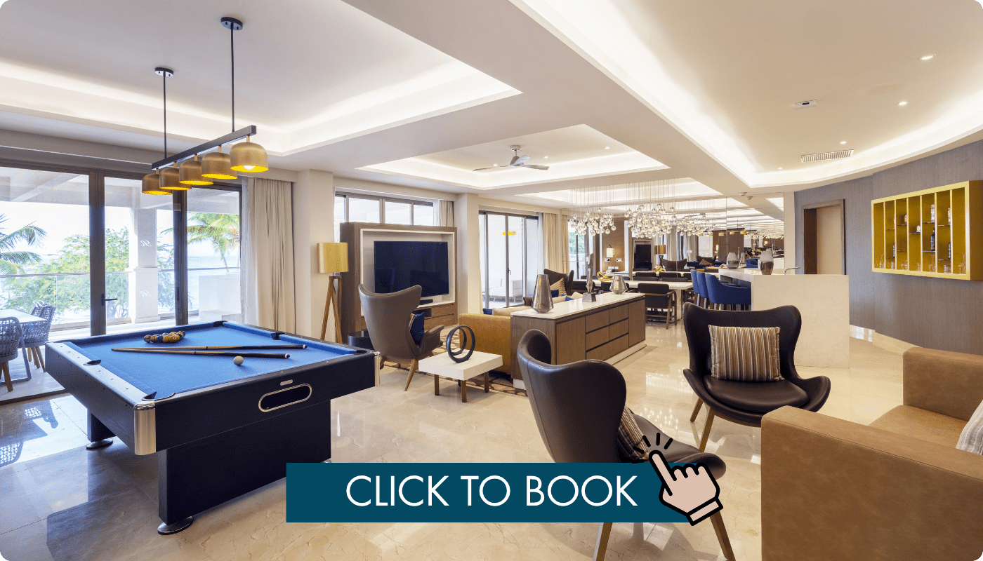 a room with pool table and chairs