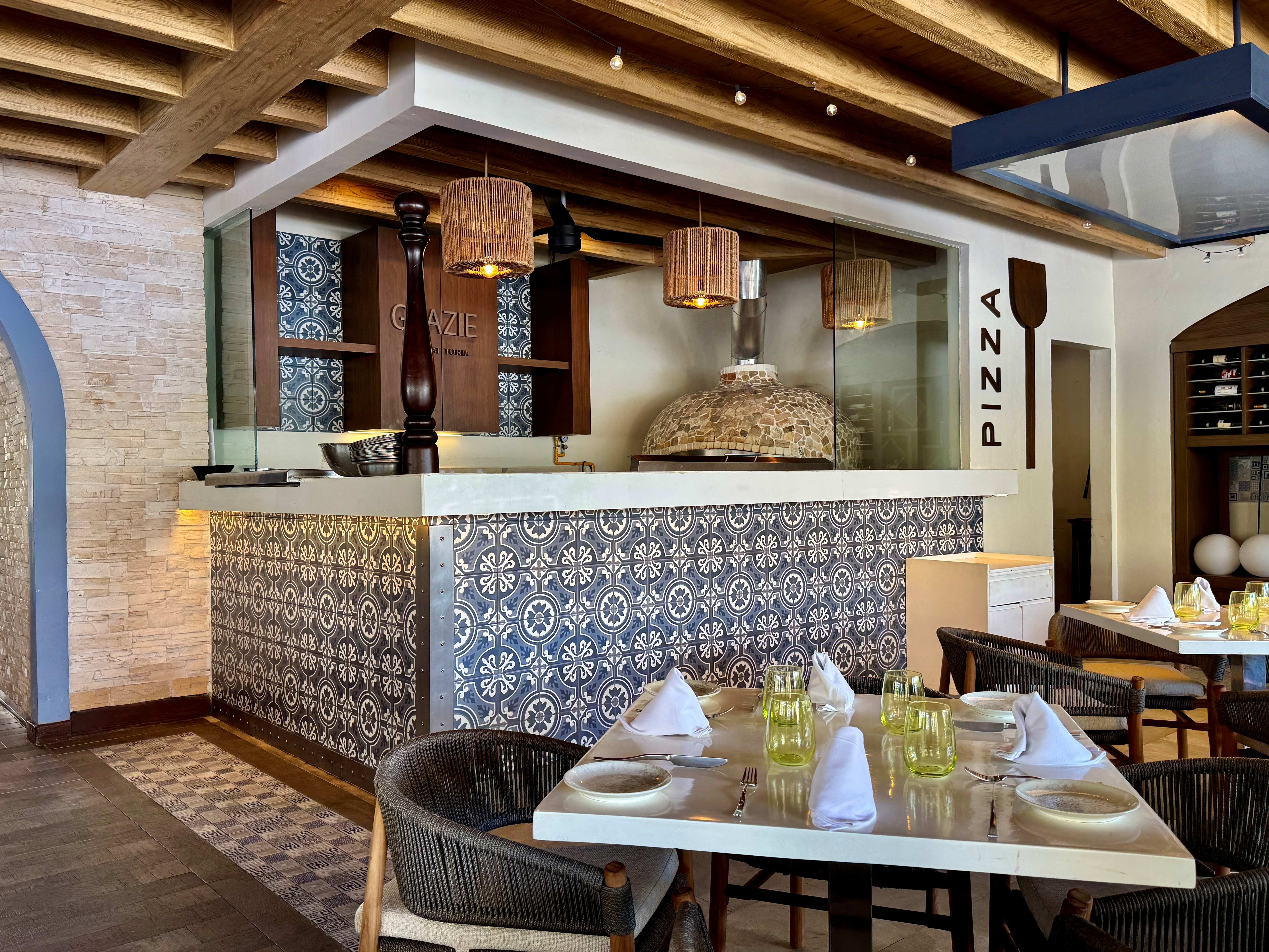 a restaurant with a pizza oven