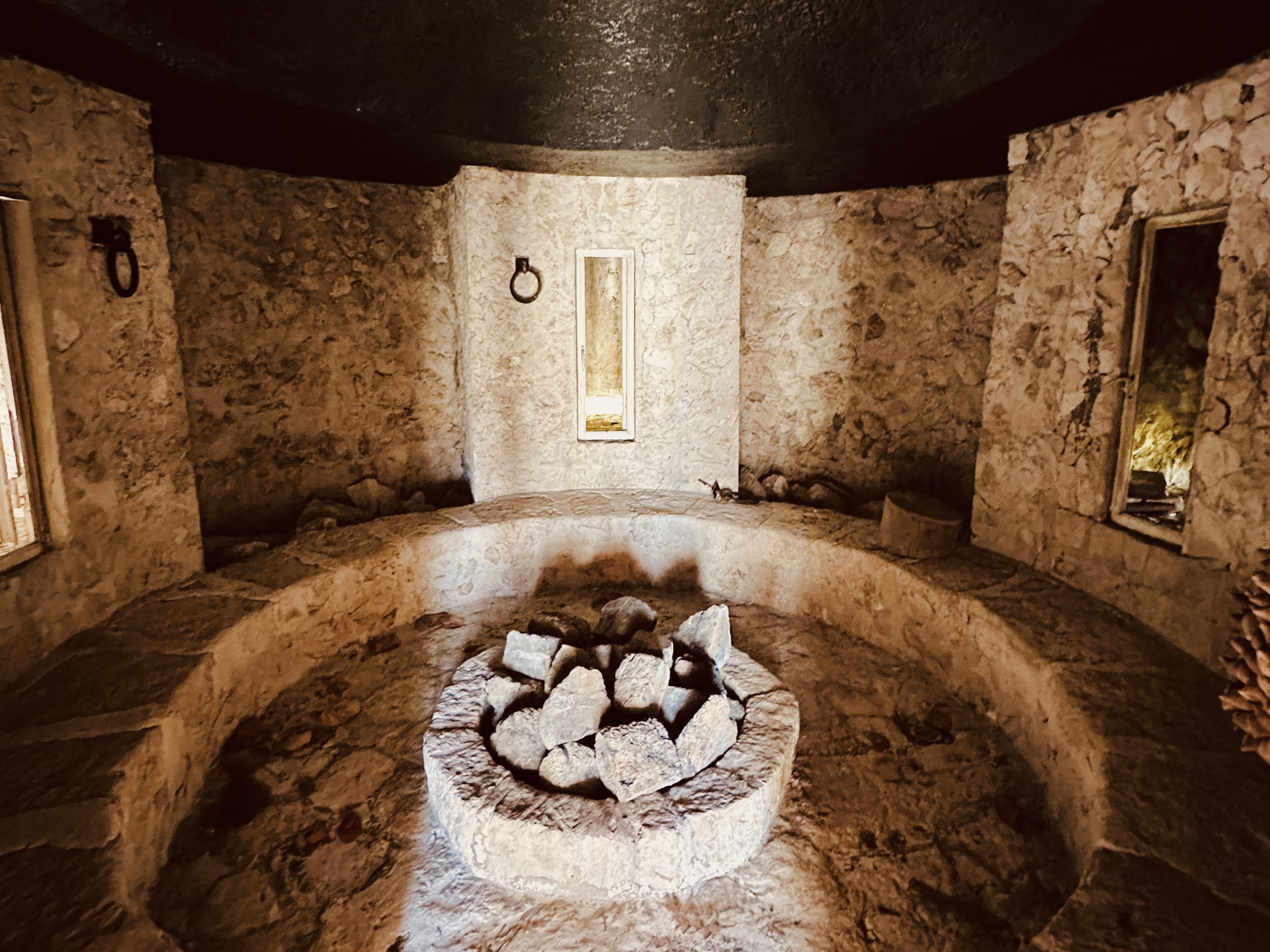 a circular stone structure with a circular object in it