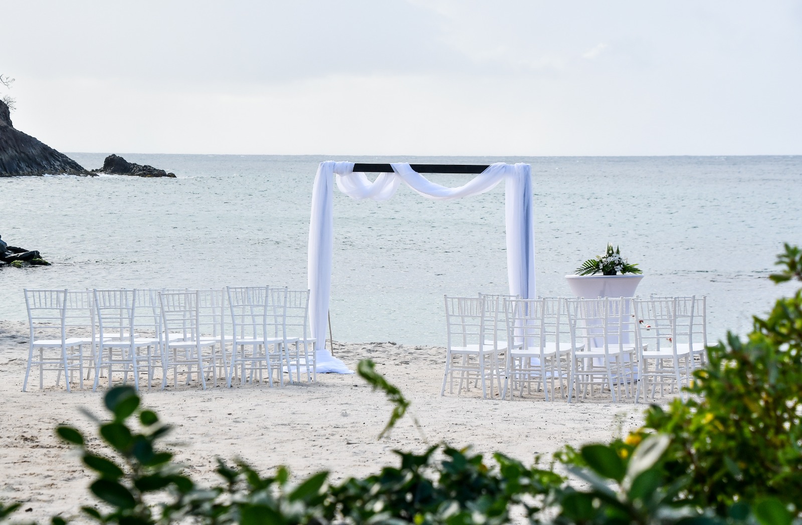 a wedding ceremony set up on a beach