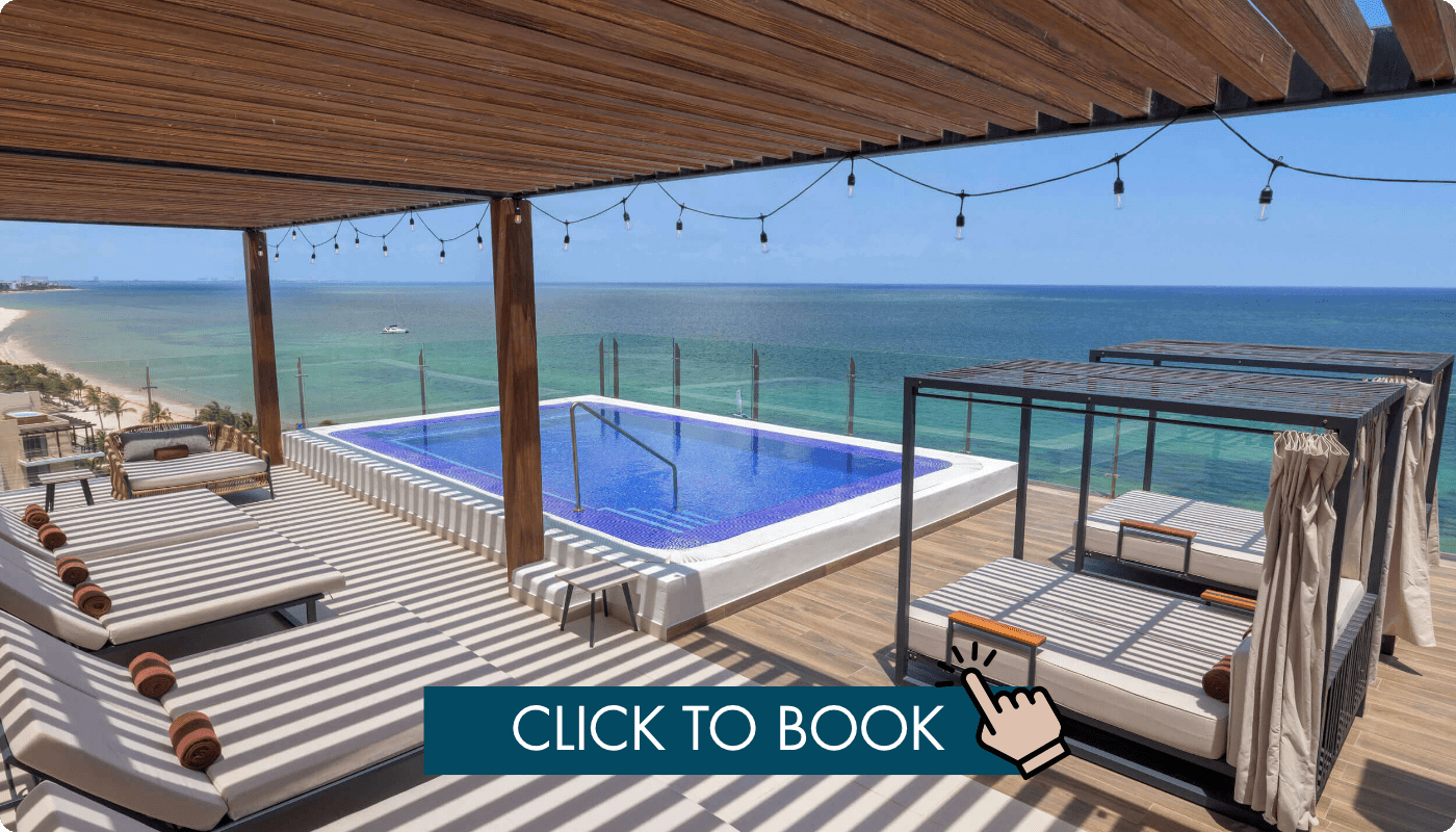 a pool with a deck and chairs on a deck with a wooden deck and a boat in the water