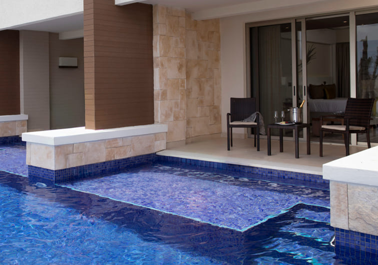 a pool with a table and chairs