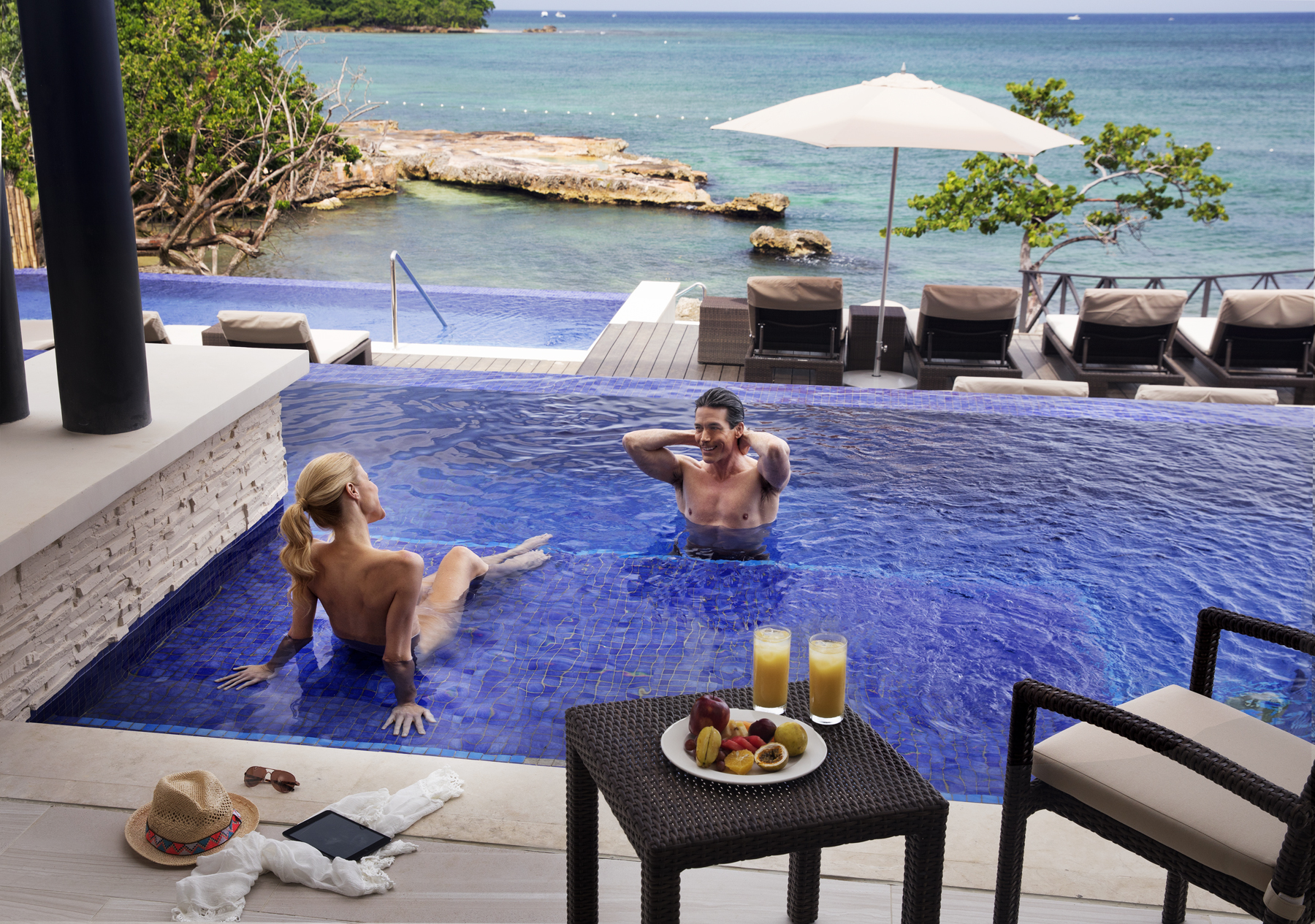 a man and woman in a pool
