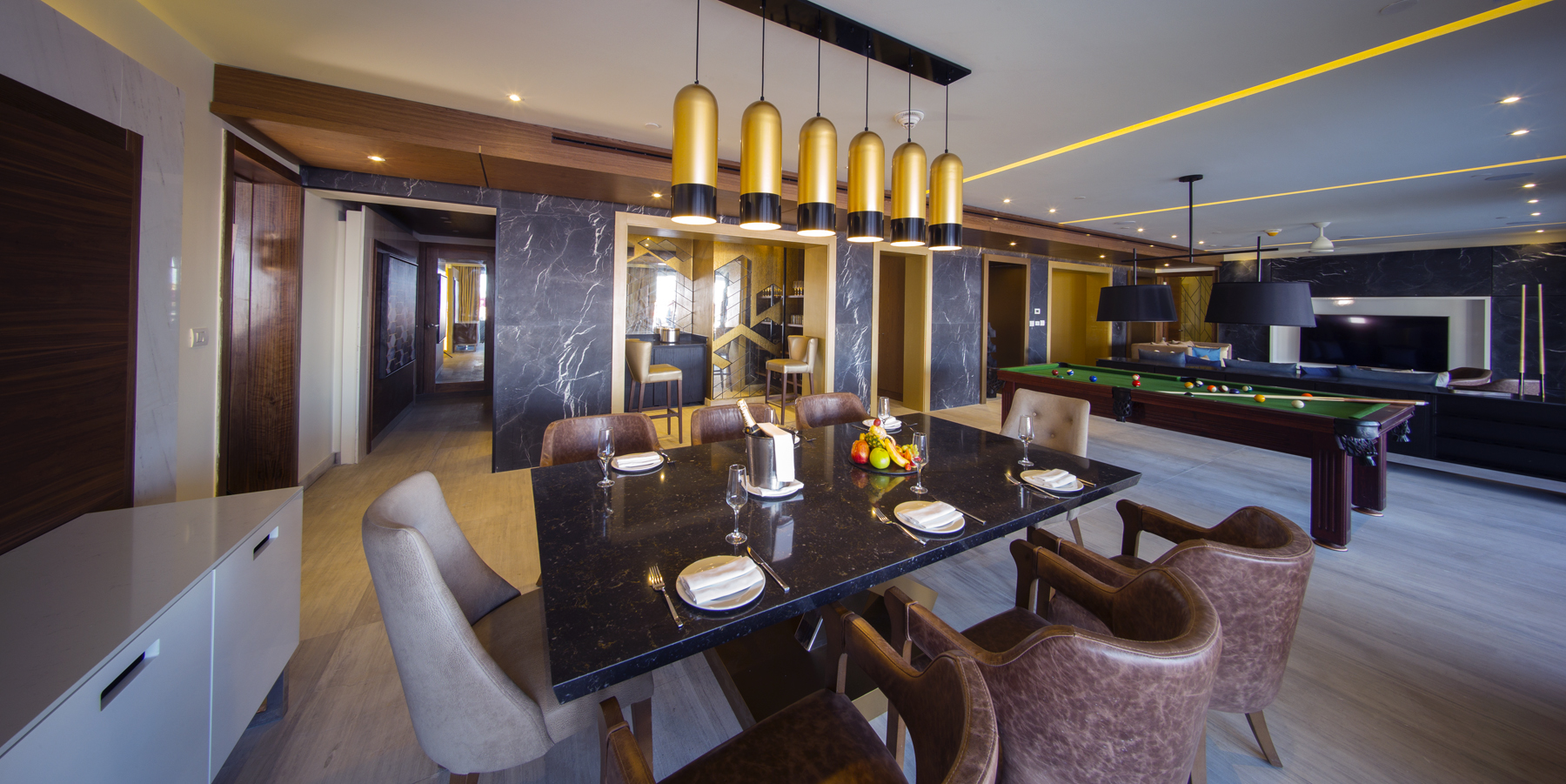 a dining room with a pool table and pool table