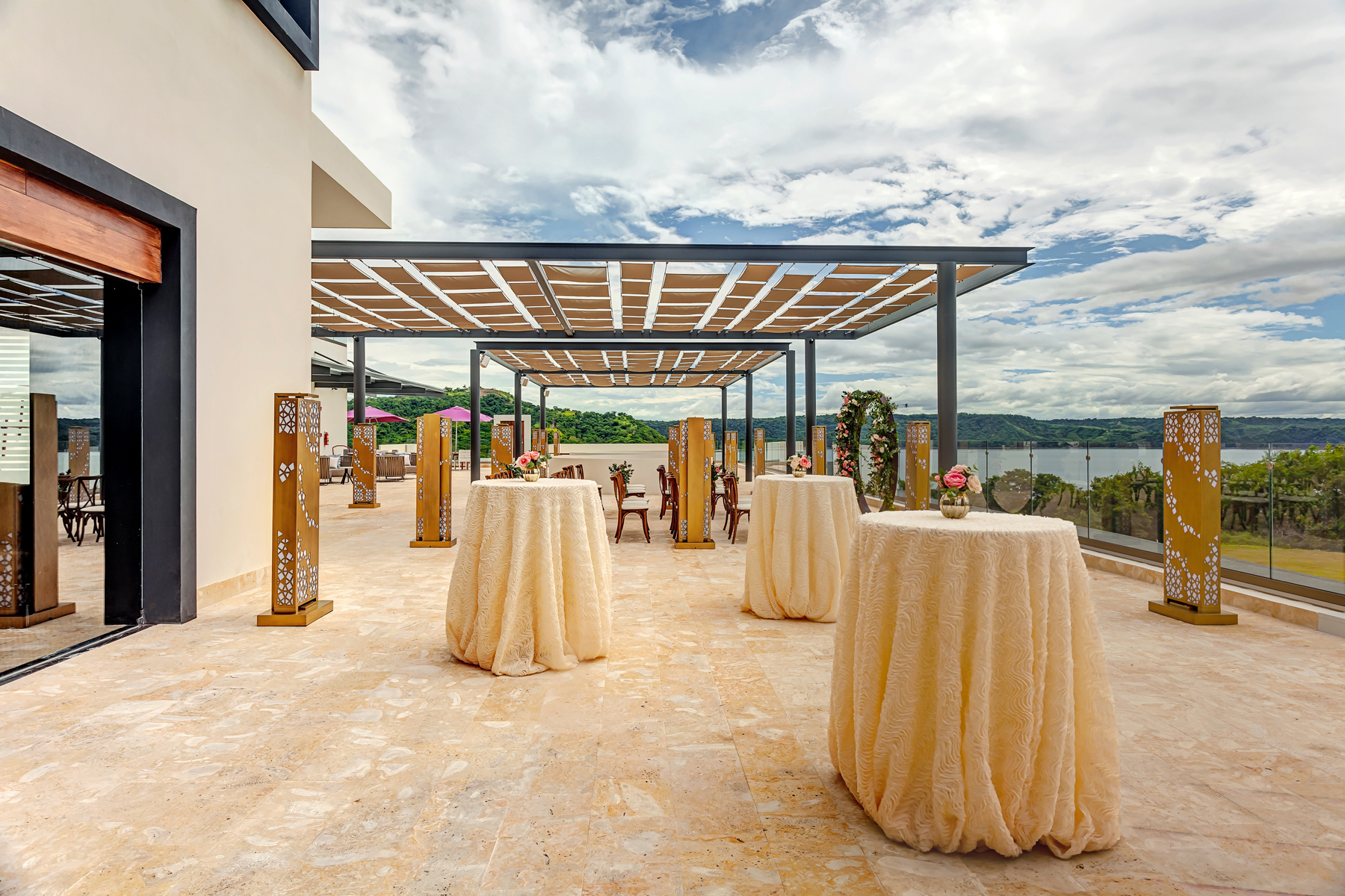 a patio with tables and chairs