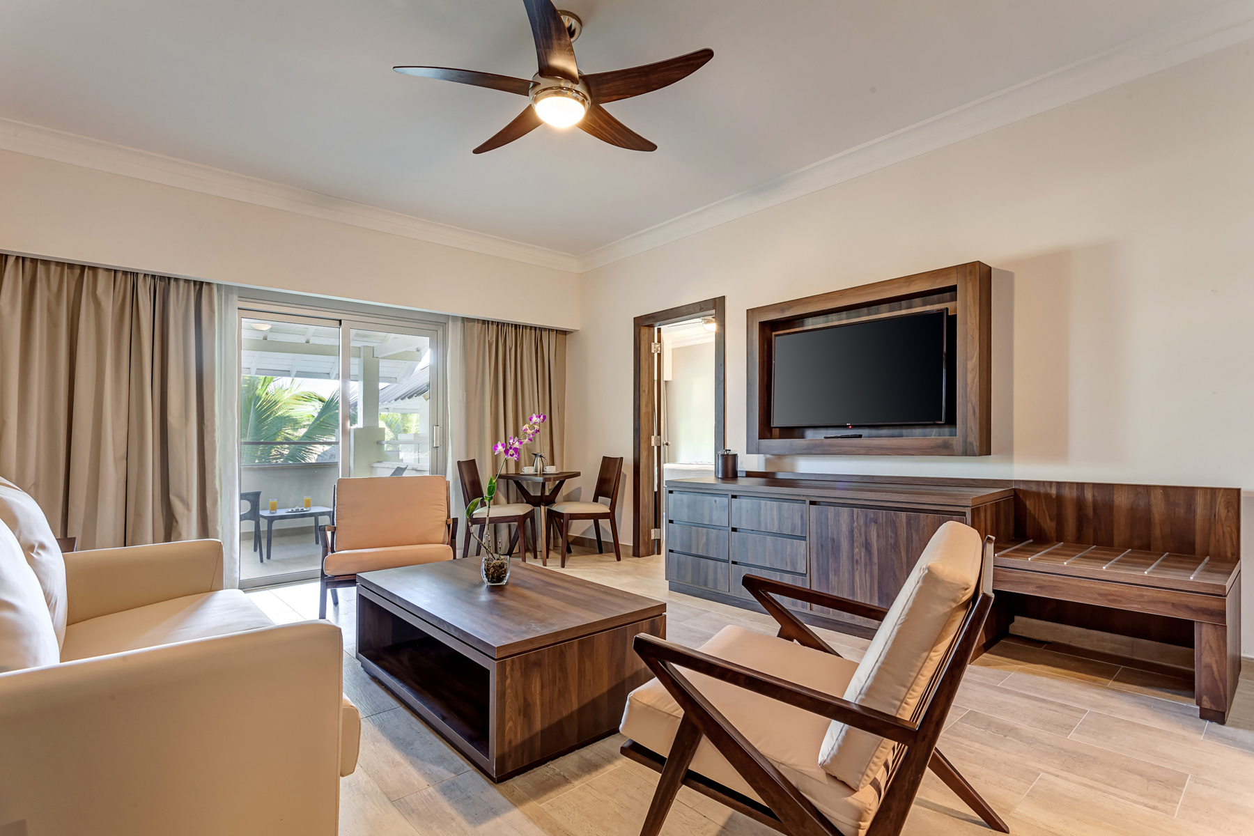 a living room with a television and a table