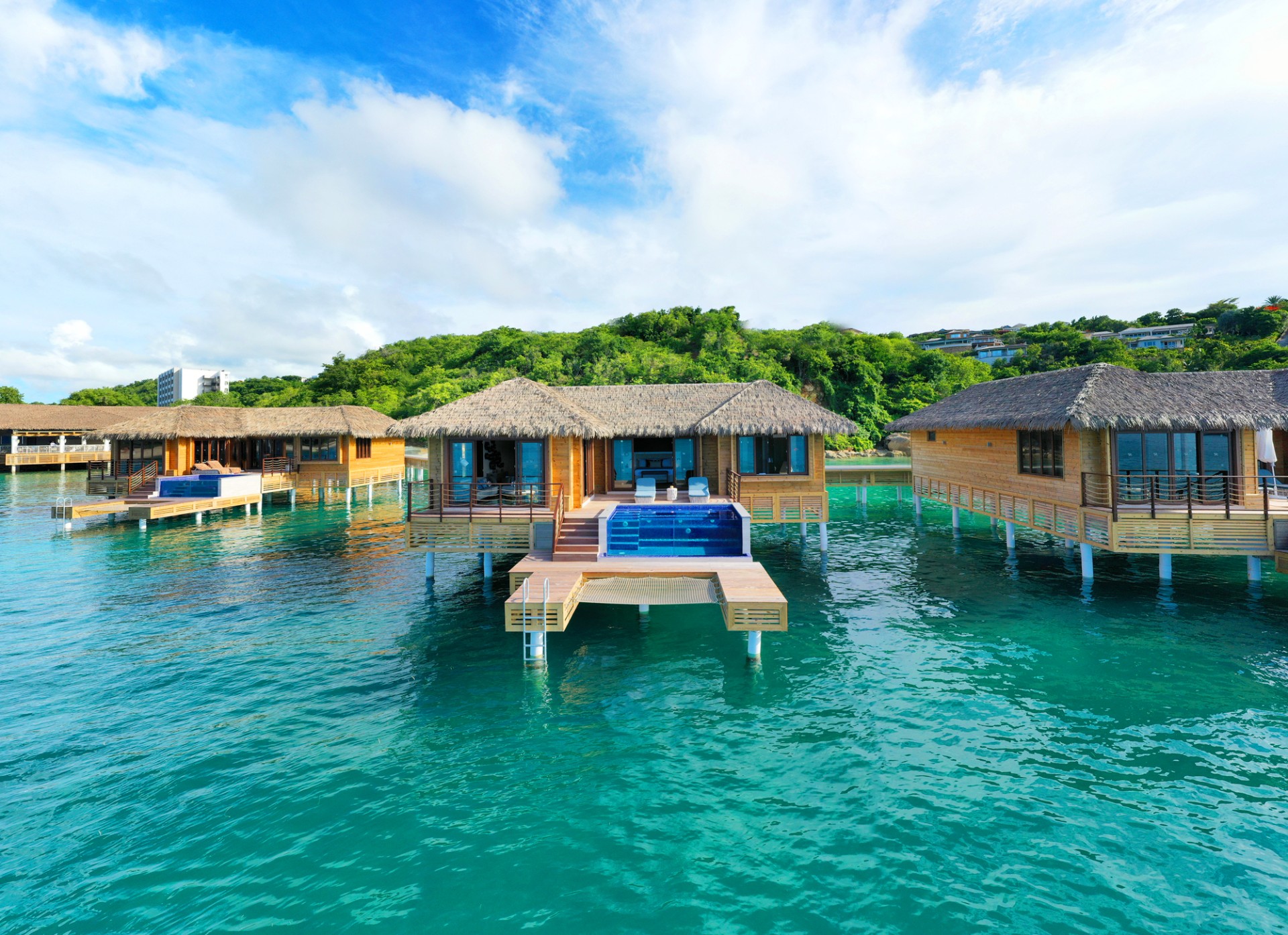 a group of houses on stilts over water
