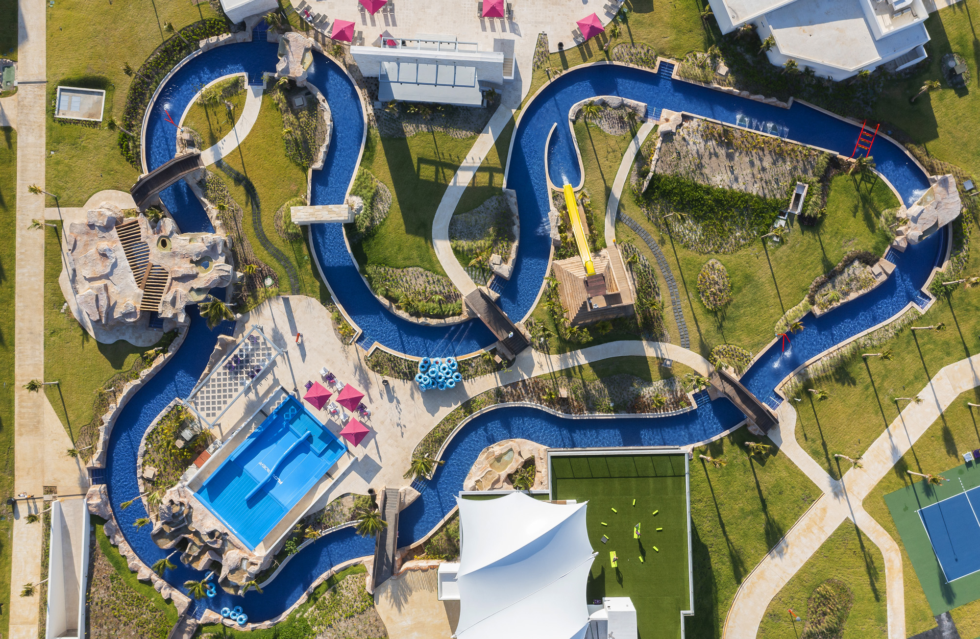 a water park with a slide and a pool