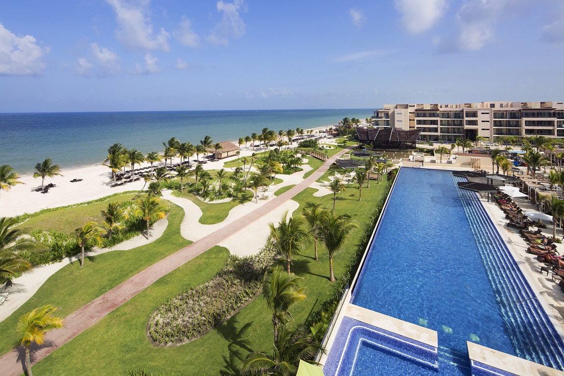 a swimming pool next to a beach