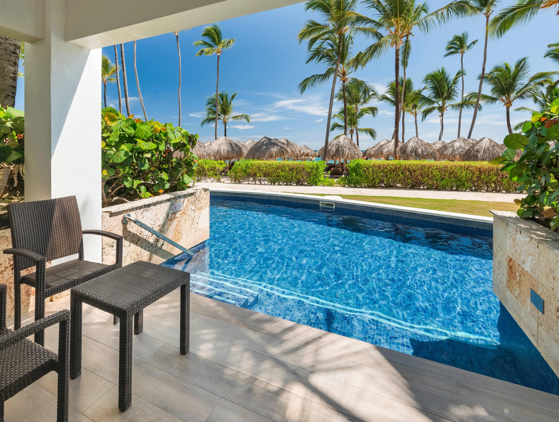 a pool with chairs and a deck