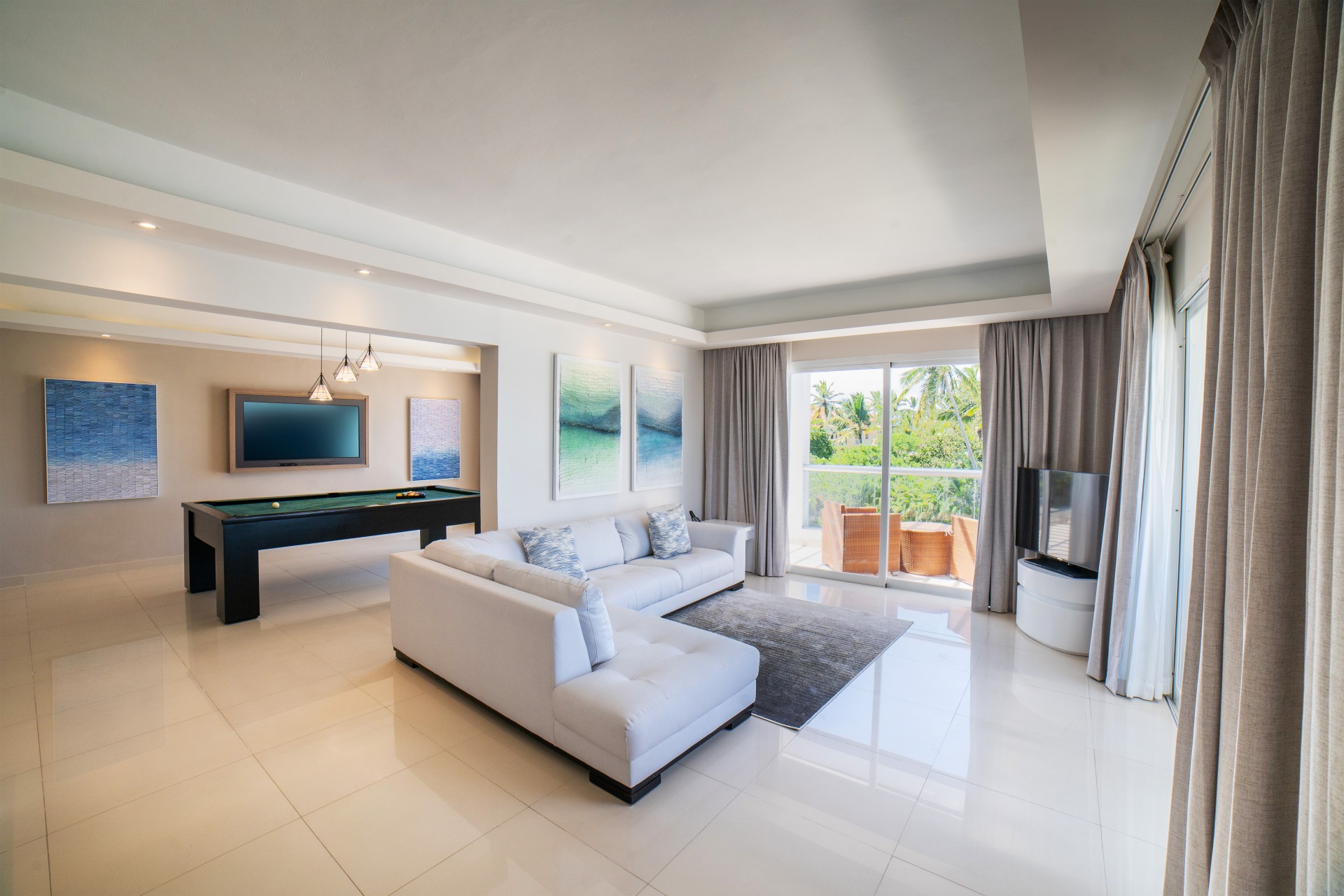 a living room with a television and a couch