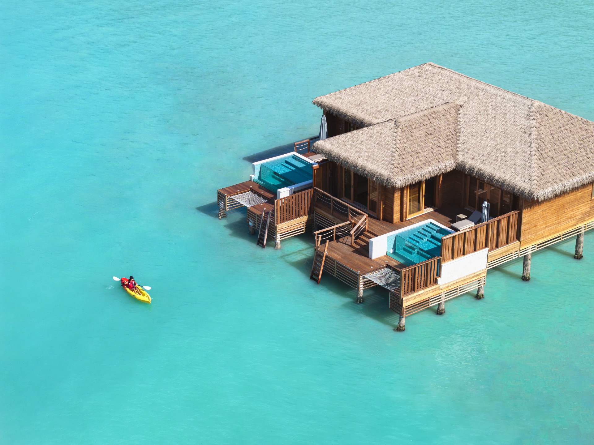 a house on stilts in the water