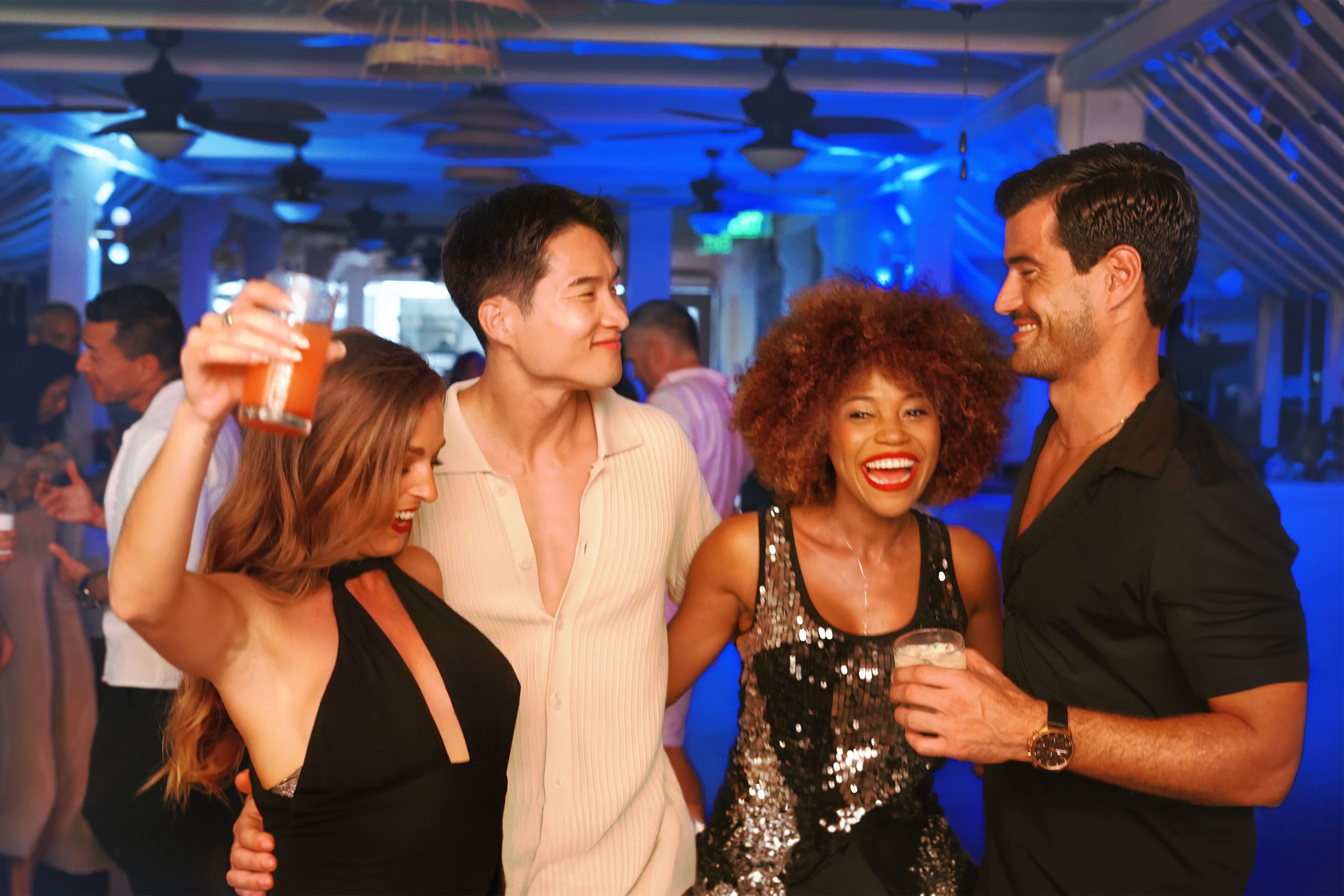 a group of people standing together and smiling