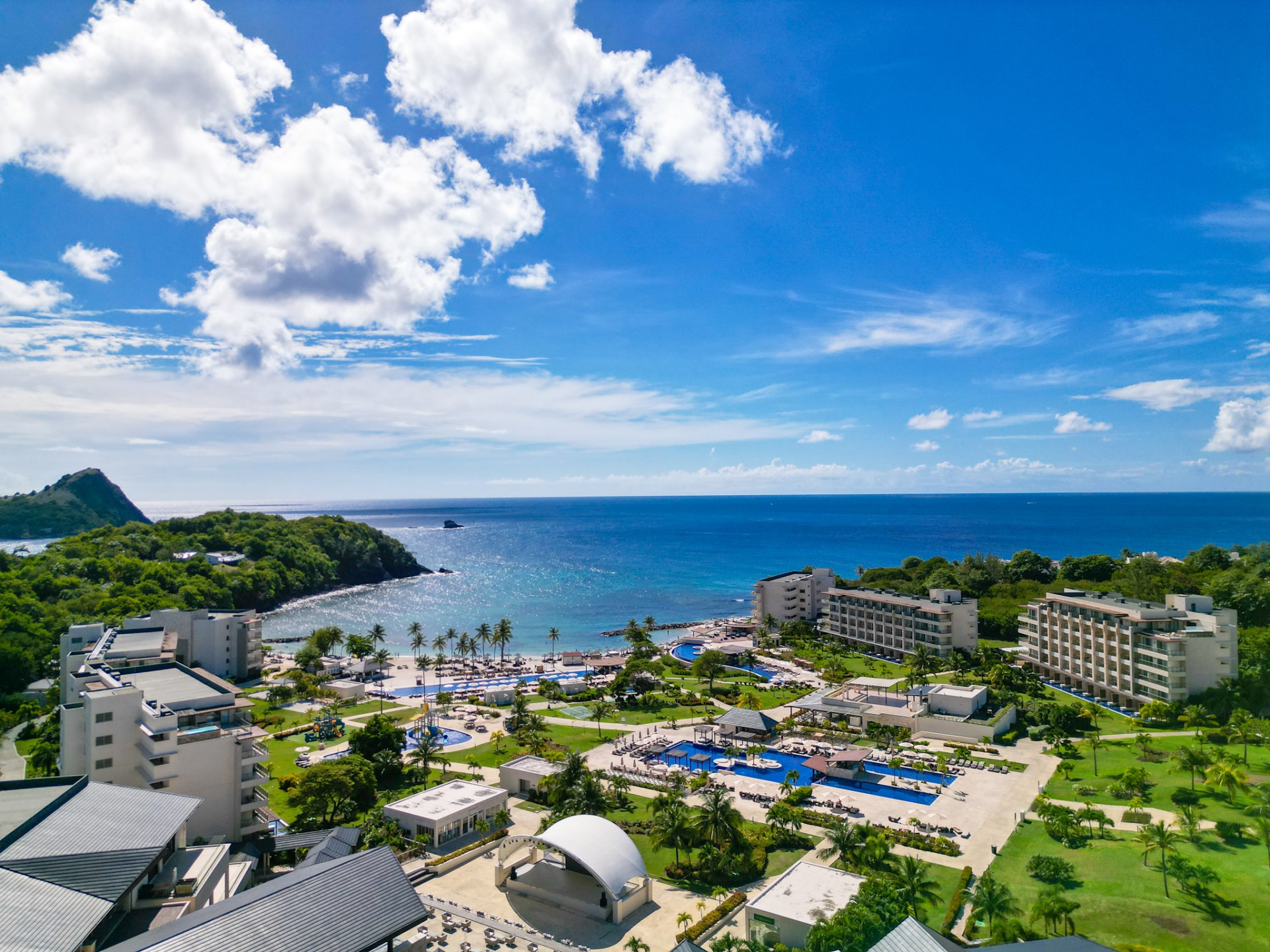 a beach with buildings and trees