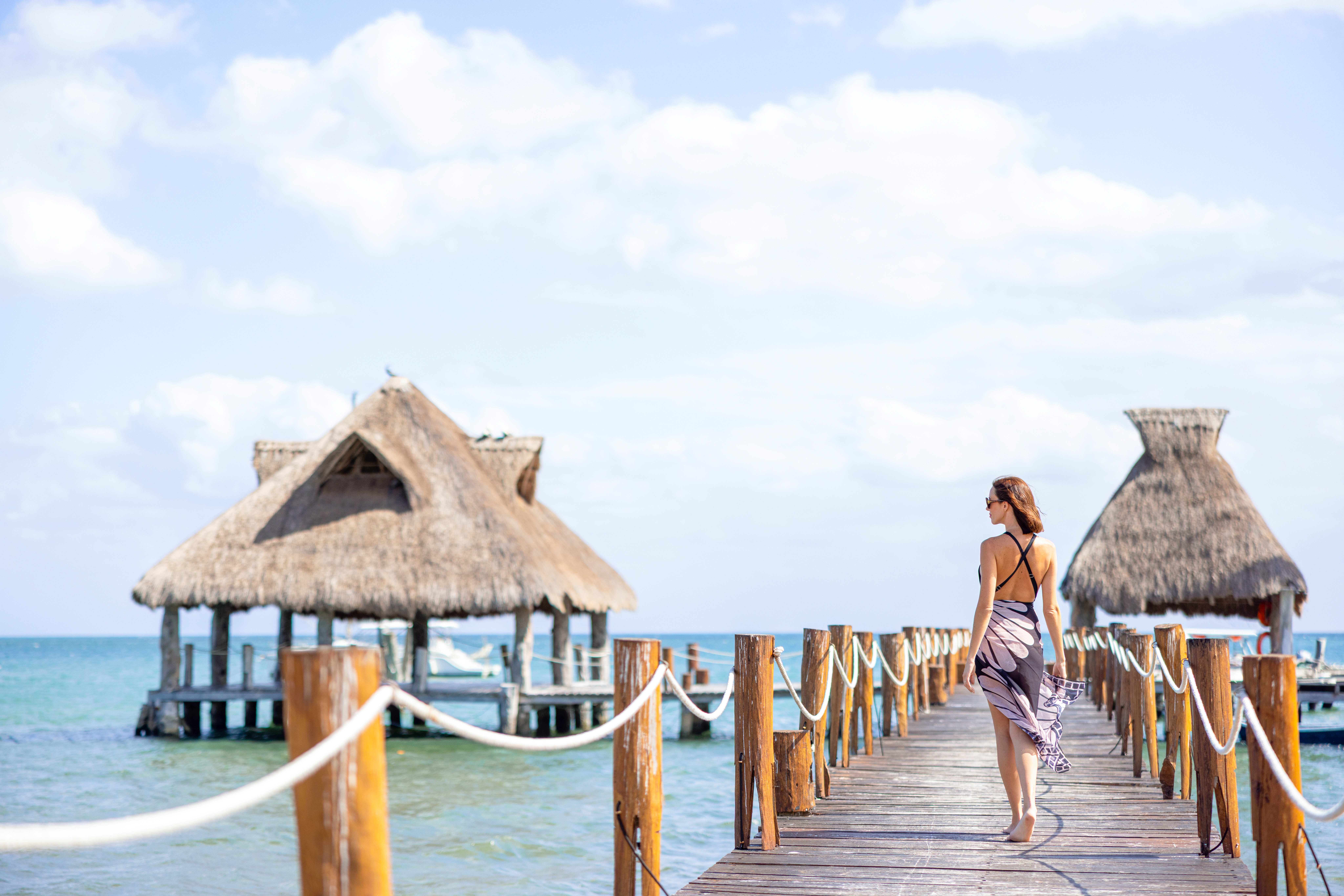 a woman walking on a dock