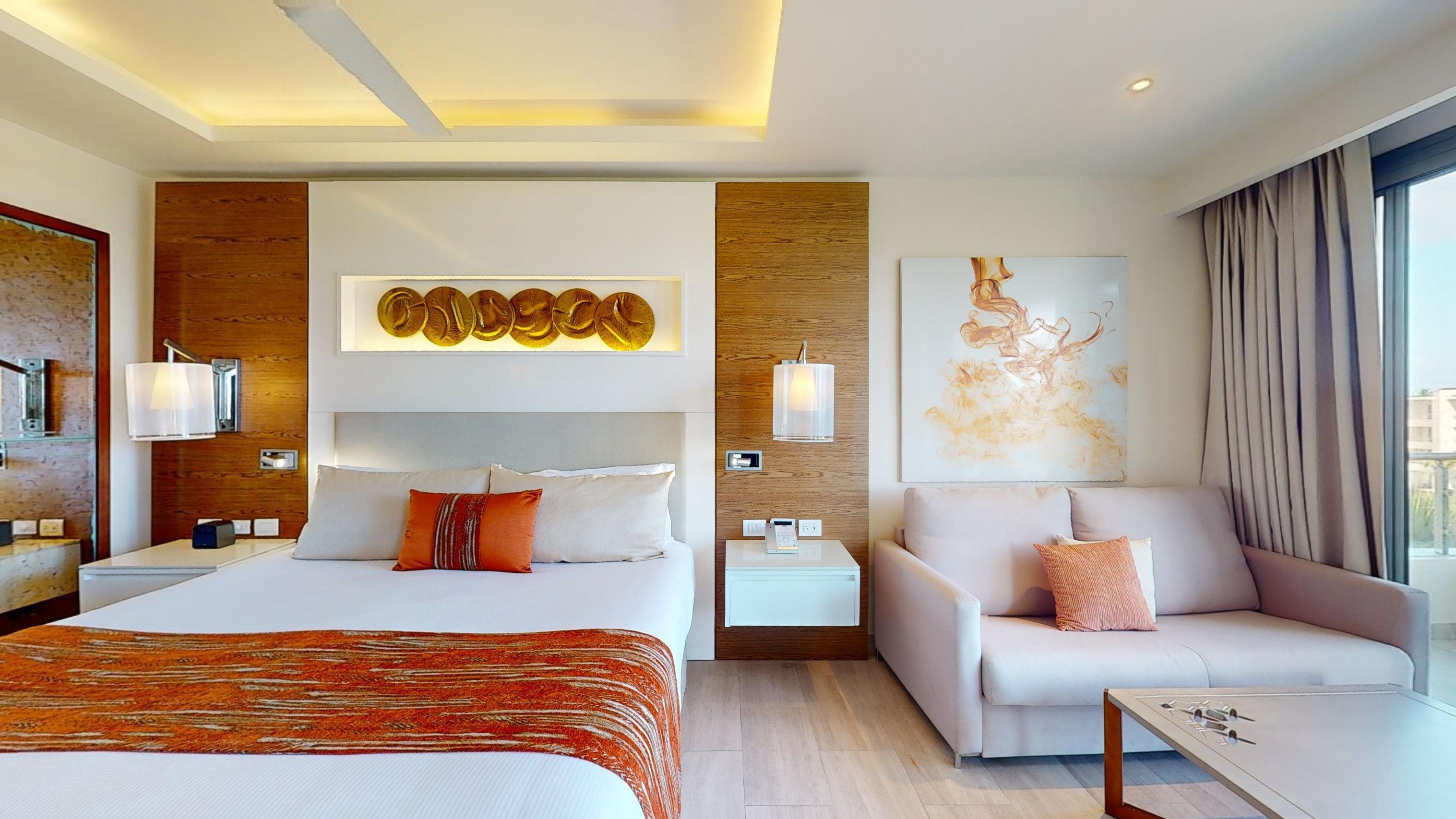 a room with a bed and couches