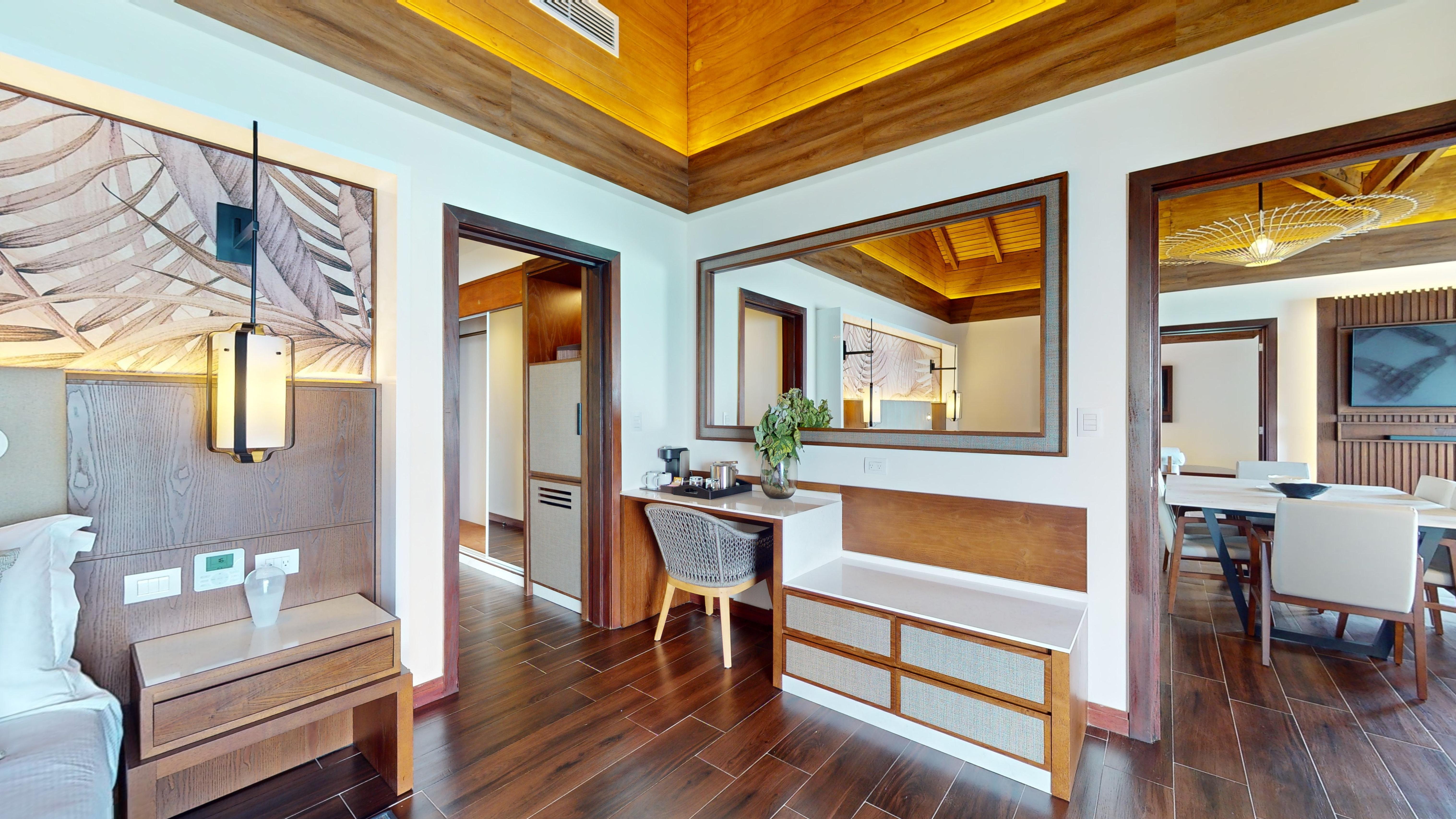 a room with a mirror and a desk