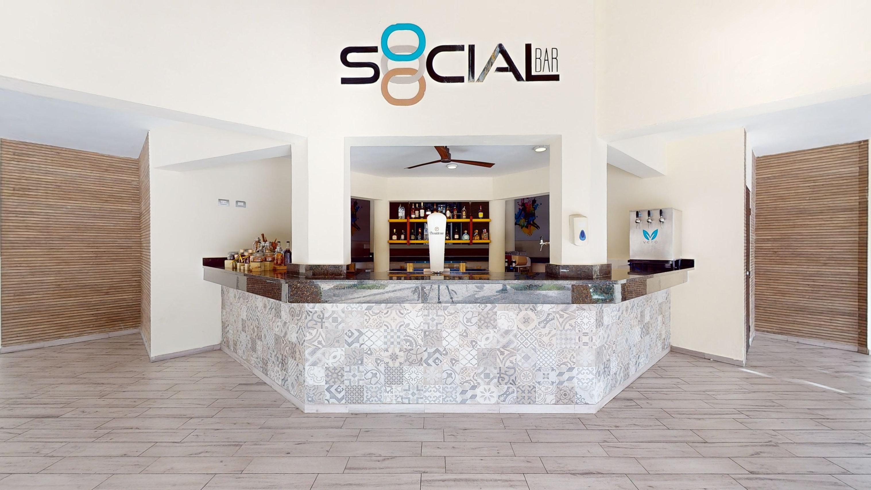 a bar with a counter and a wood floor