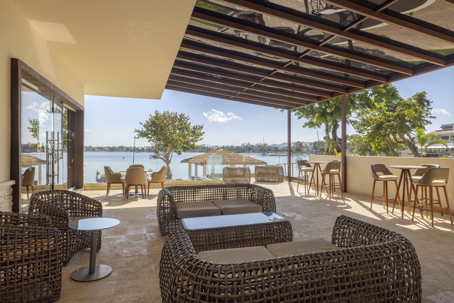 a patio with wicker furniture and chairs