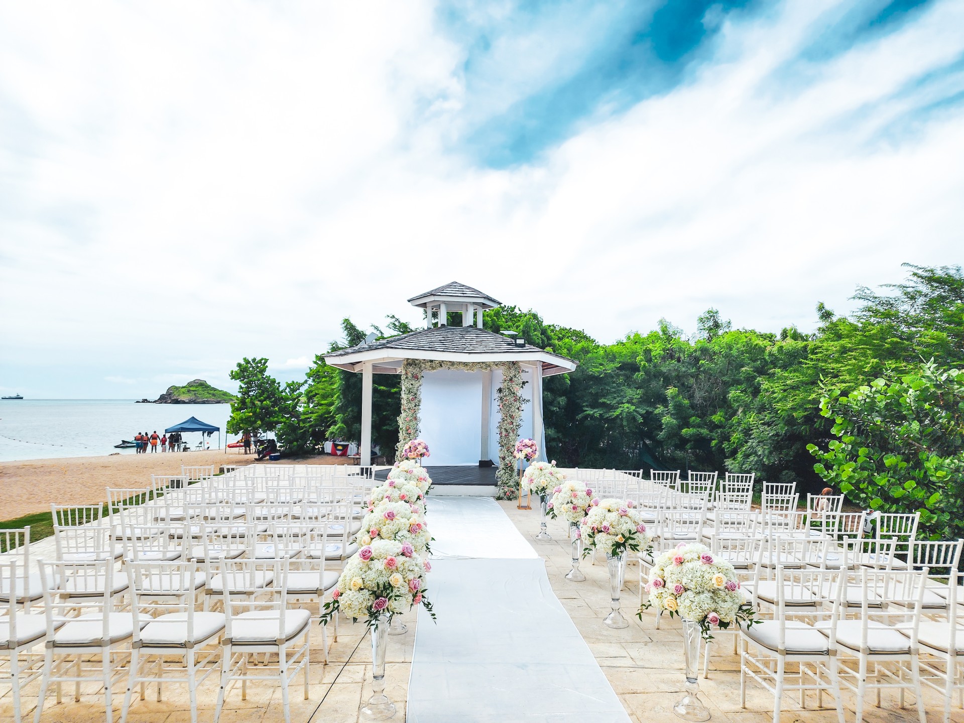 a wedding ceremony set up with chairs and flowers