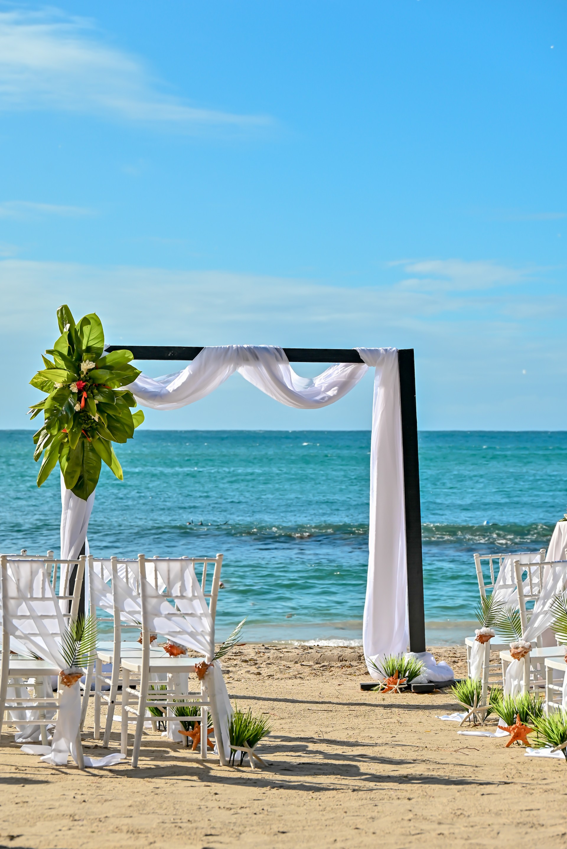 a wedding ceremony set up on a beach