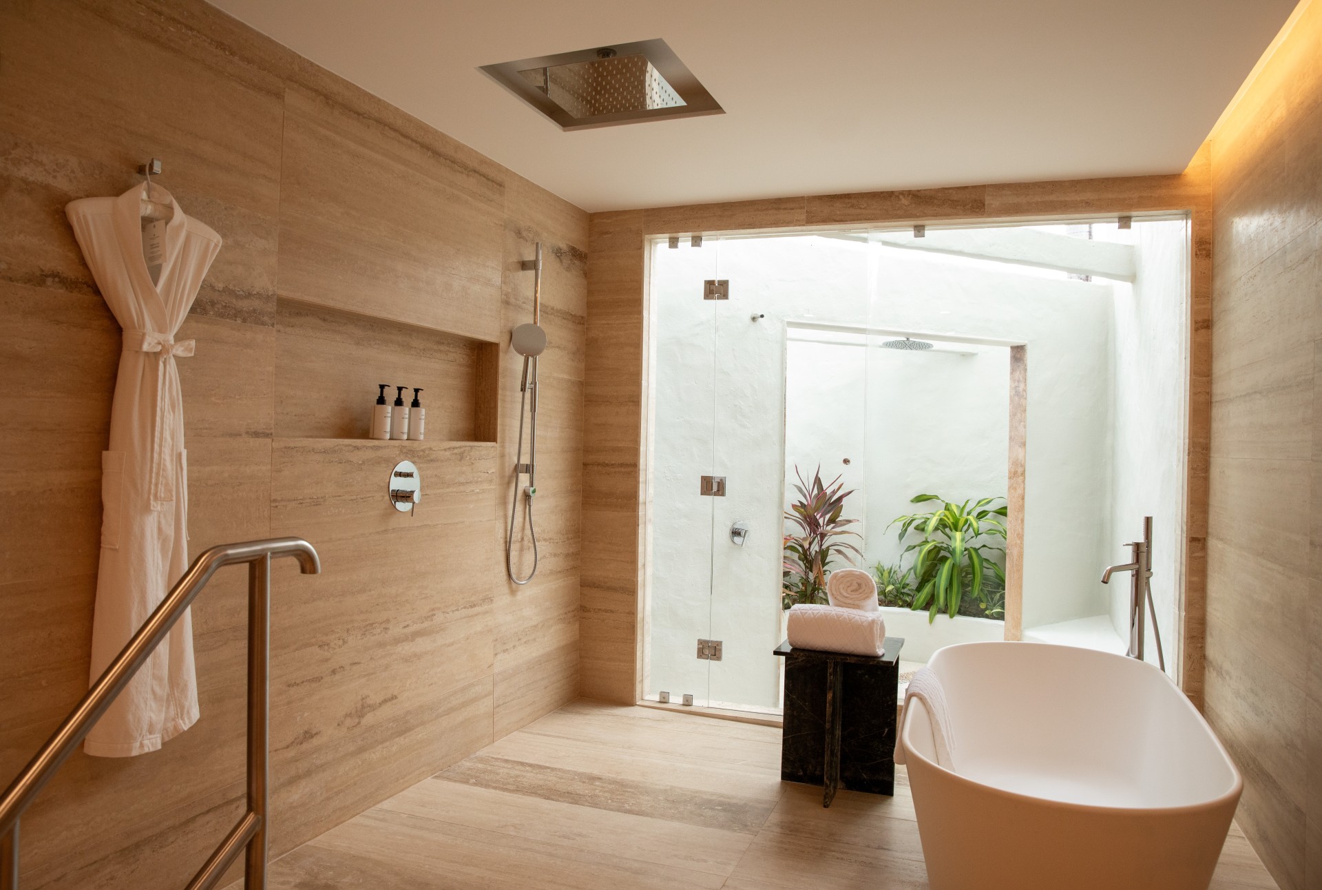 a bathroom with a tub and shower