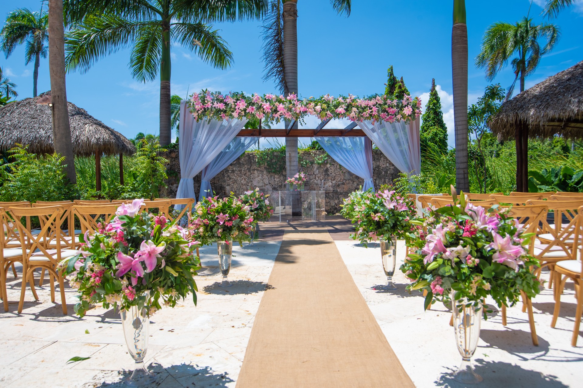 a wedding ceremony with flowers and chairs