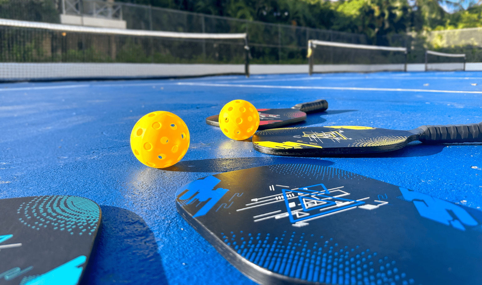 paddles and paddles on a blue surface with a net and a net and a net