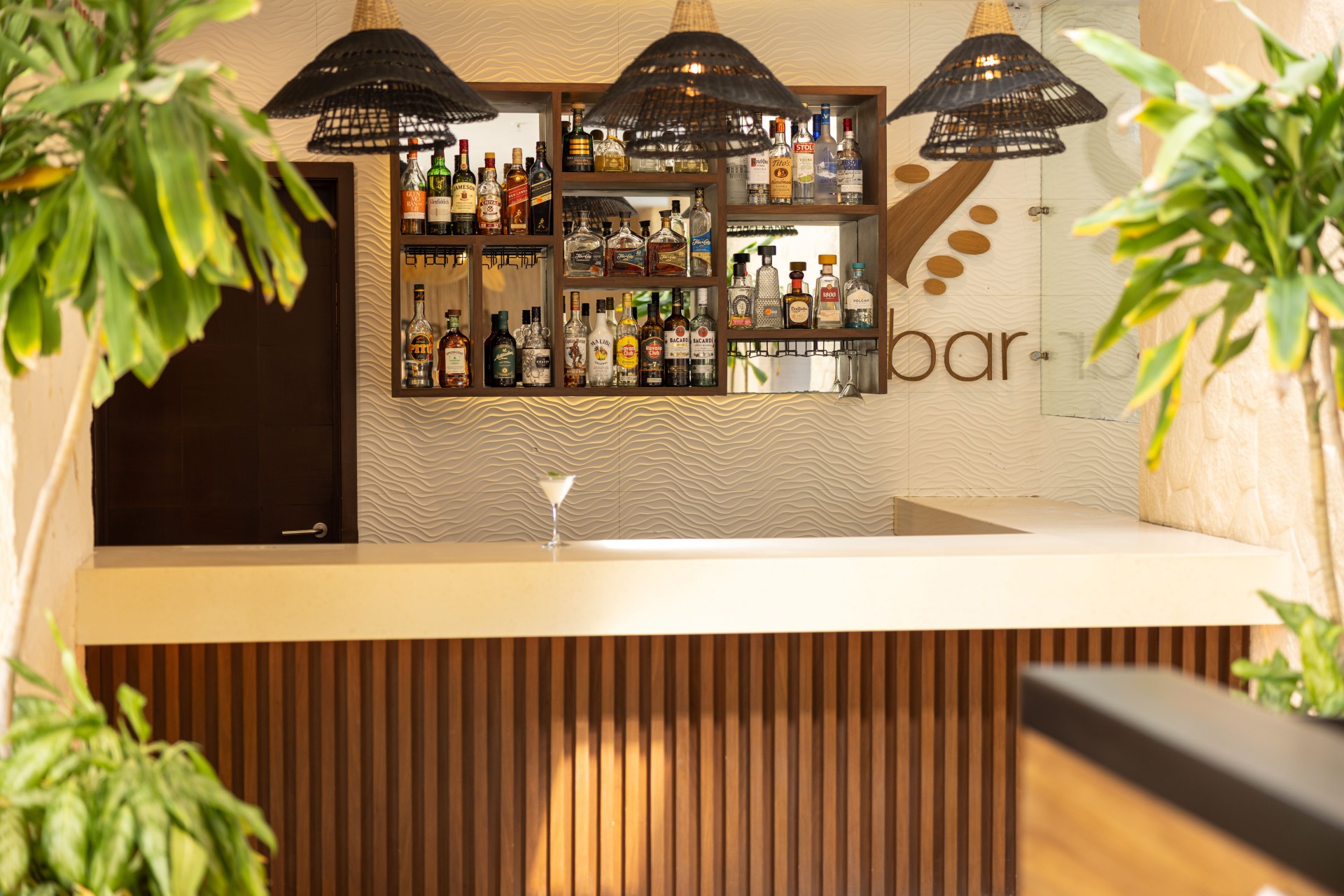 a bar with bottles of alcohol