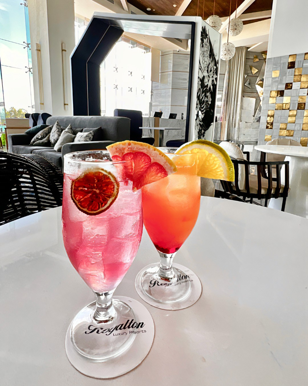 two glasses with fruit on them