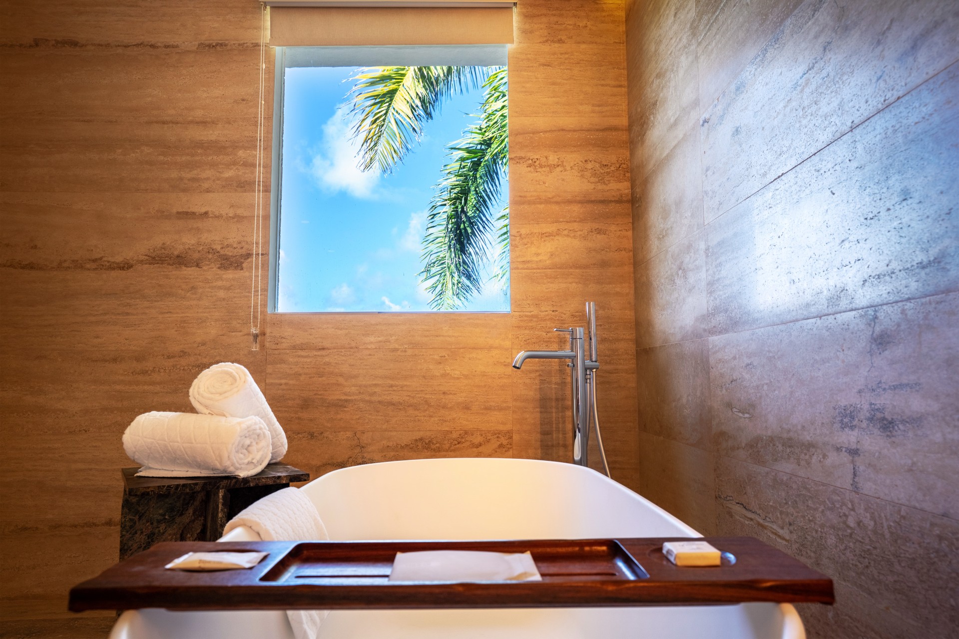 a bathtub and towels in a bathroom