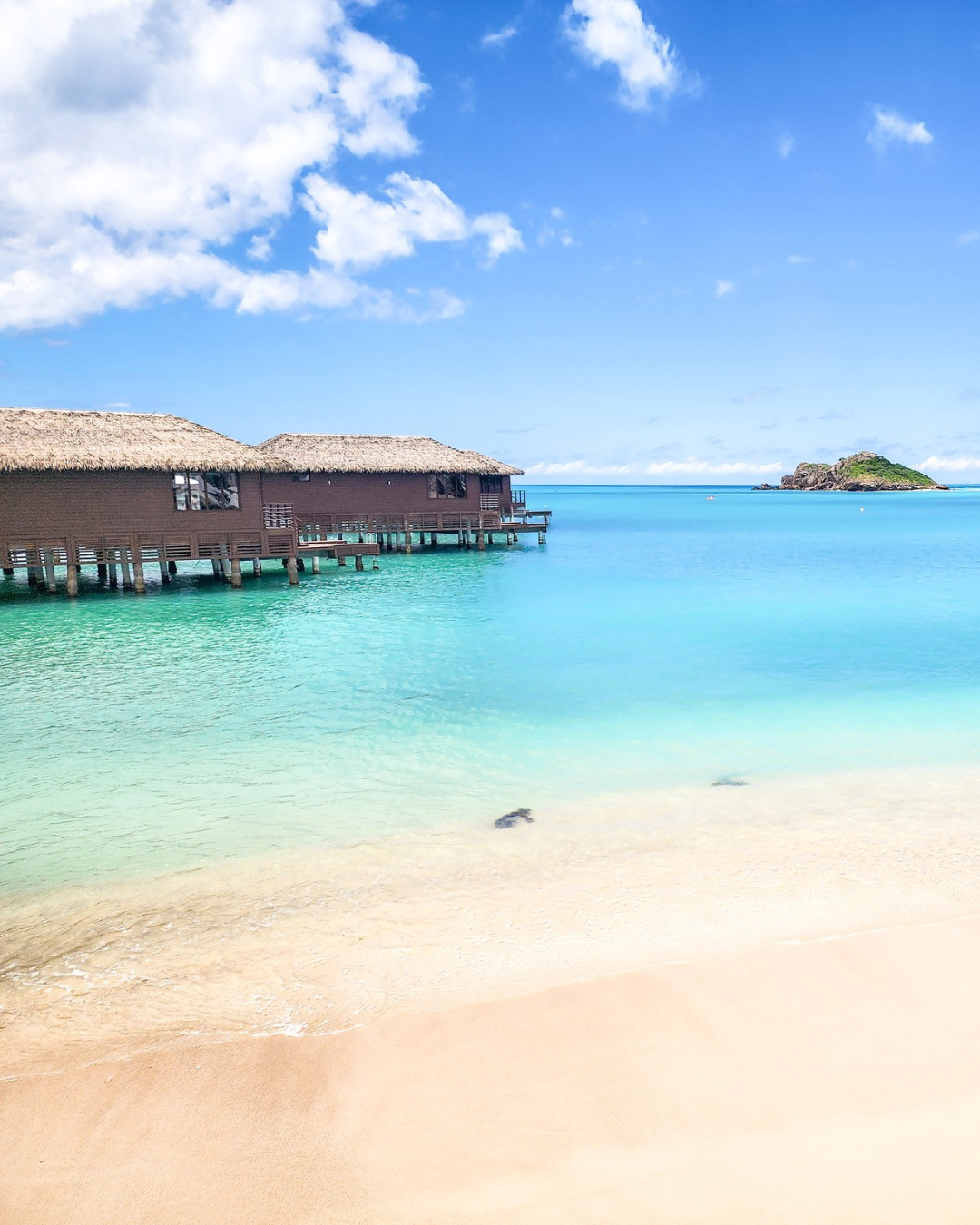a hut on stilts in the water