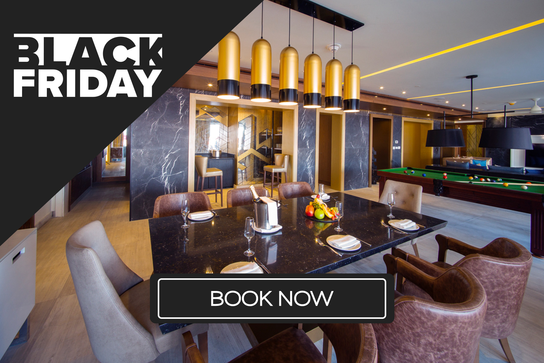 a black and gold room with a table and chairs