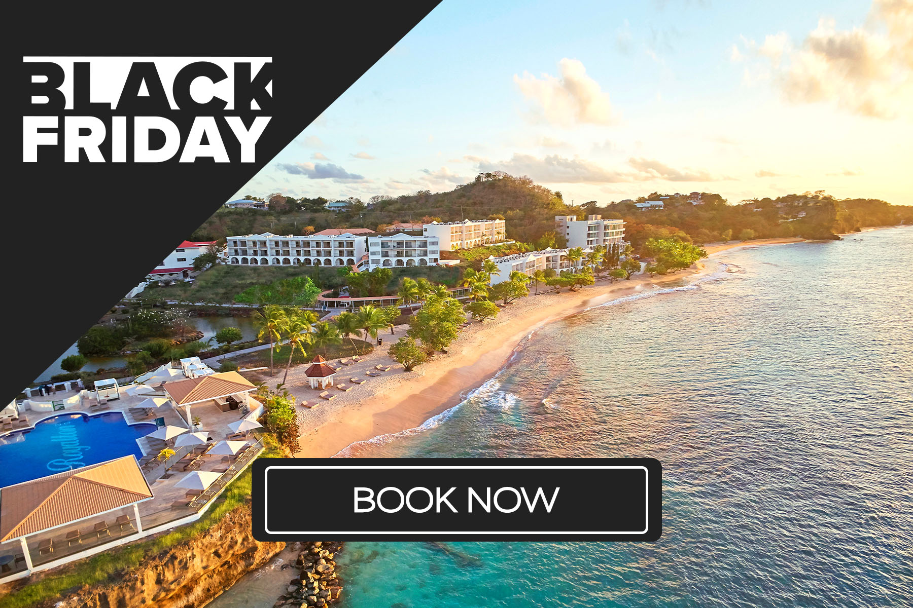 a beach with buildings and a body of water