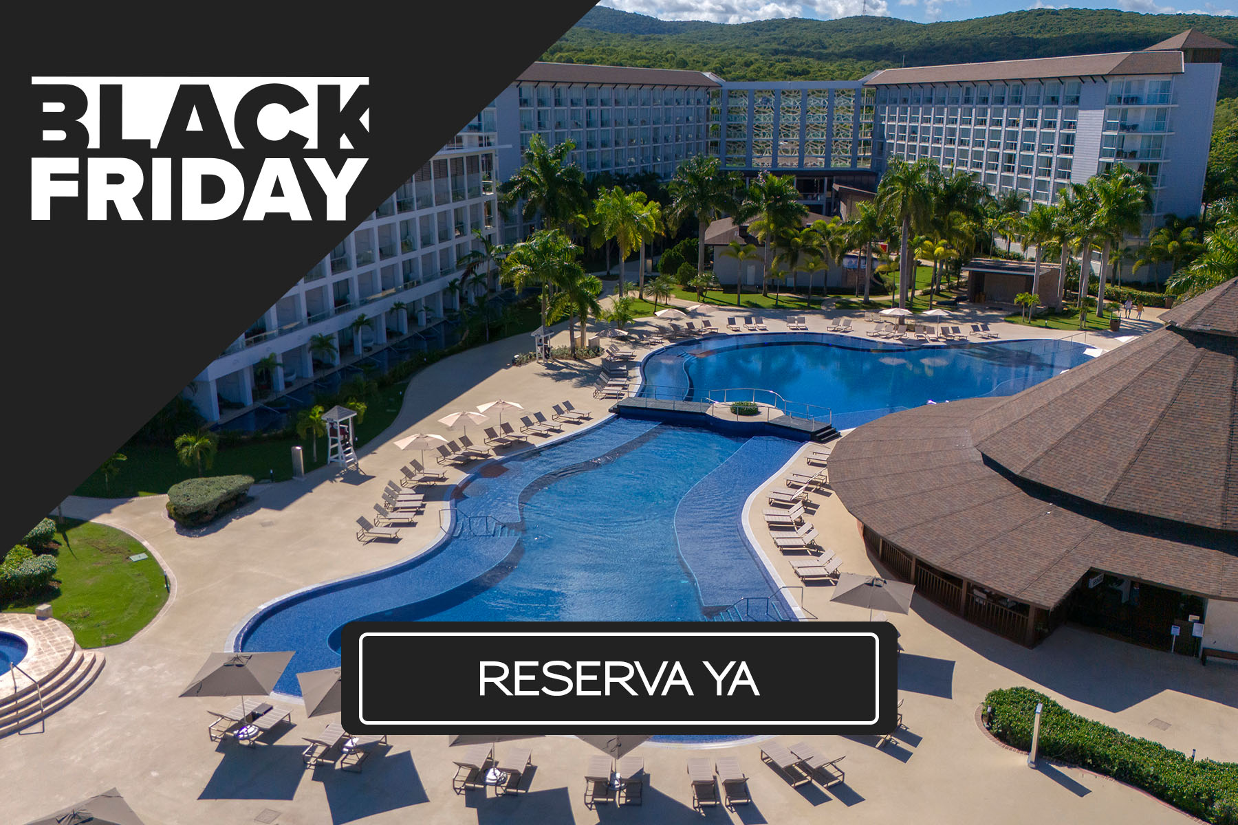 a pool with lounge chairs and a building with trees in the background