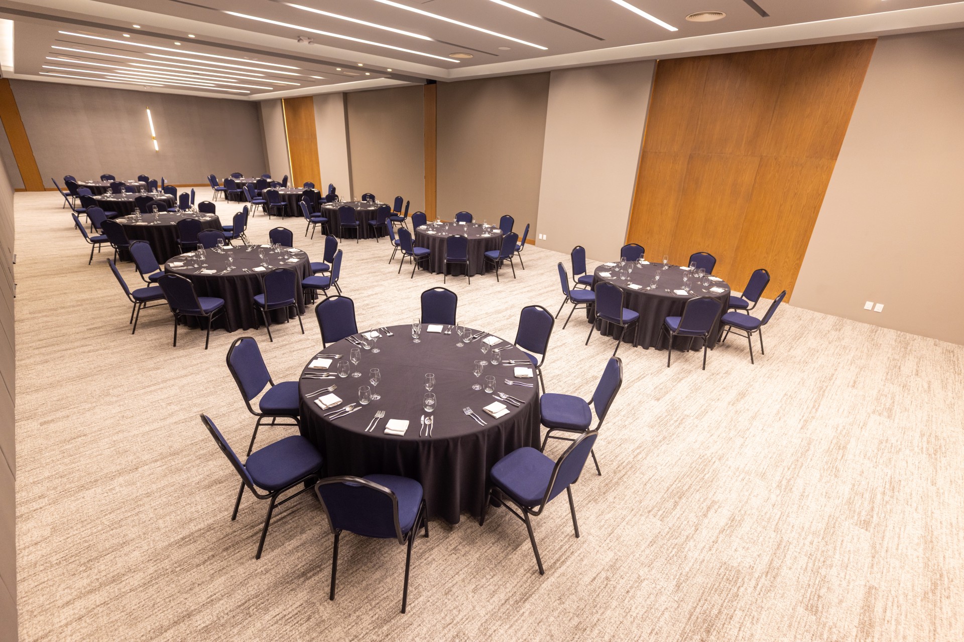 a room with round tables and chairs