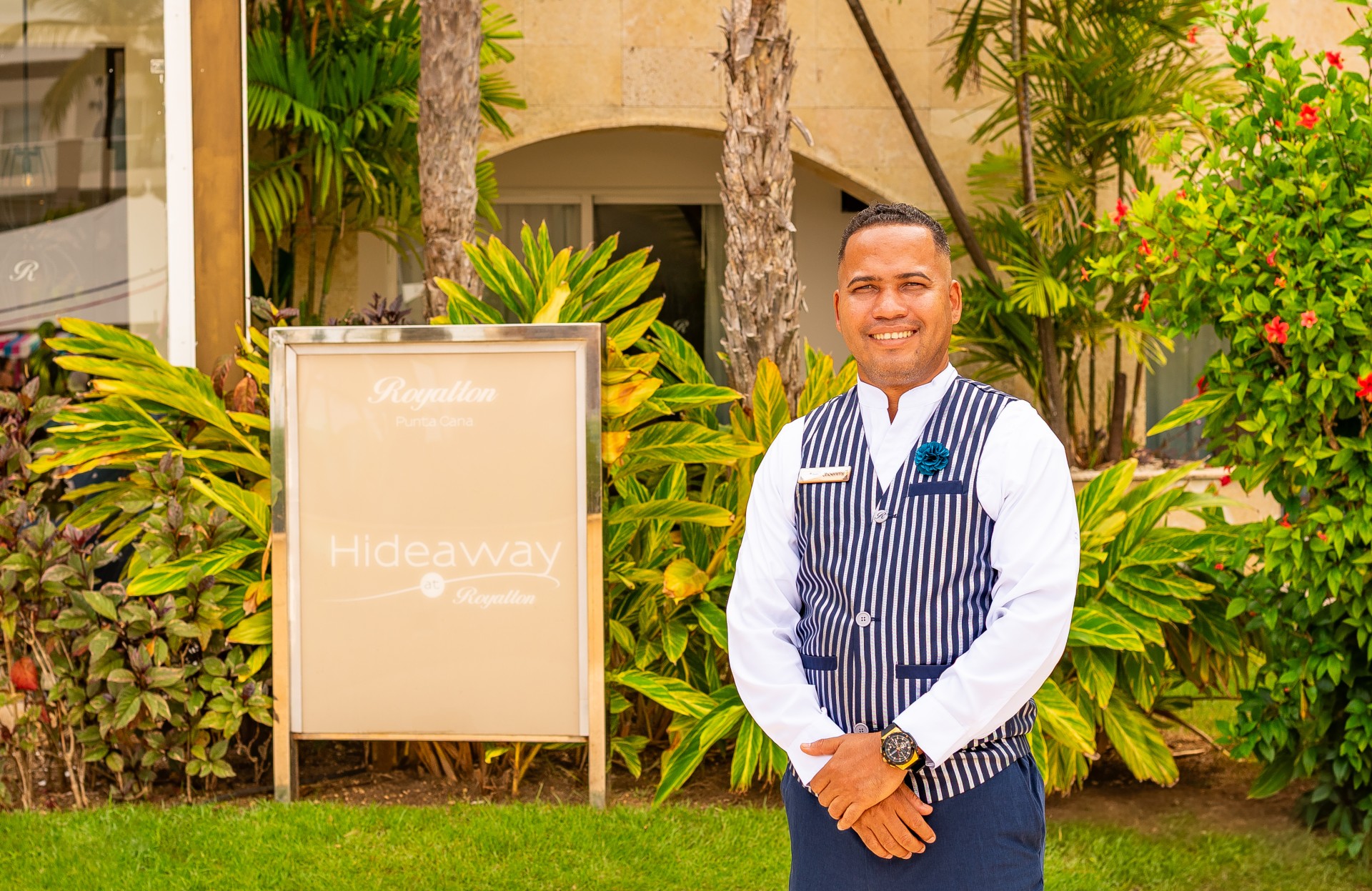 a man standing in front of a sign