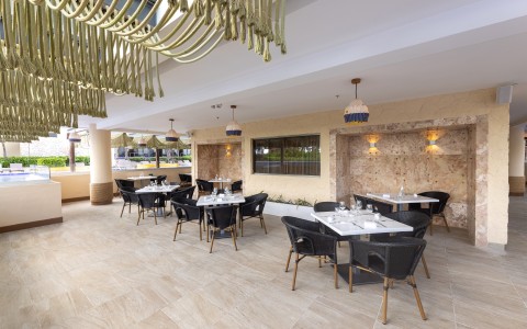 a restaurant with tables and chairs