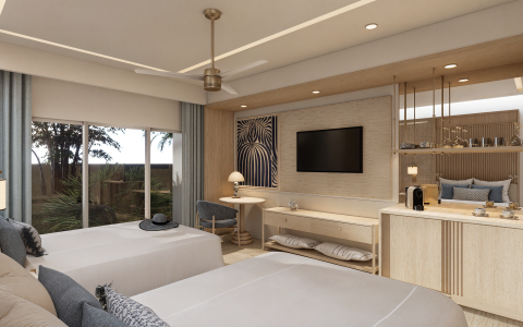 a room with two beds and a television