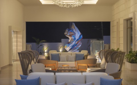 a room with chairs and a chandelier