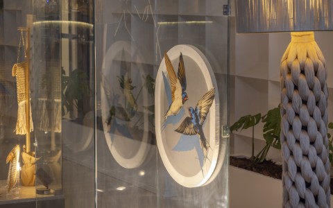 a glass wall with a picture of birds on it