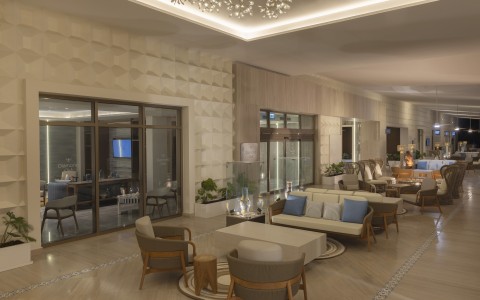 a lobby with chairs and tables