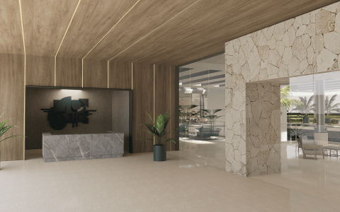 a lobby with a stone wall and a glass door