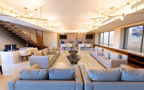 a large room with couches and a table