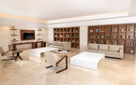 a room with a tv and couches