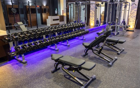 a gym with weights and equipment