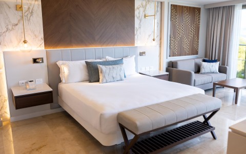 a bed with pillows in a room