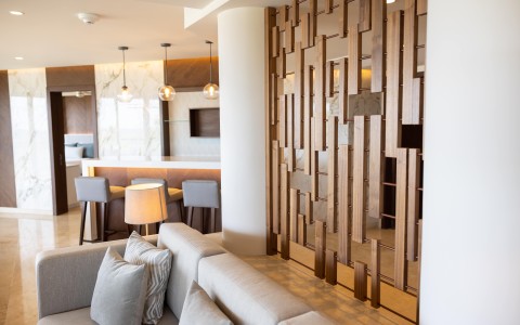 a room with a couch and a wood partition